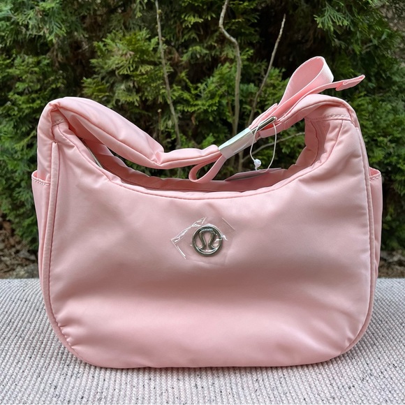 lululemon athletica Handbags - NWT - Lululemon Mini Shoulder Bag 4L (in Pink Mist?)